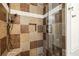 Tiled shower with built-in seat and shower niche and adjustable shower head at 1922 Olde Village Run, Dunwoody, GA 30338