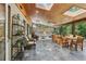 Spacious sunroom with slate floors, wood ceilings with skylights, fireplace, and comfortable seating at 1922 Olde Village Run, Dunwoody, GA 30338