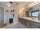 Bathroom with double vanity, large mirrors and tile flooring at 230 Wild Barley Way, Loganville, GA 30052