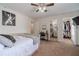 Bedroom with ceiling fan, desk, and walk-in closet at 230 Wild Barley Way, Loganville, GA 30052