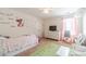 Bedroom with colorful decor and carpeted flooring at 230 Wild Barley Way, Loganville, GA 30052