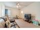 Bonus room featuring comfortable seating, exercise equipment, and a view to the laundry room at 230 Wild Barley Way, Loganville, GA 30052