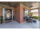 Inviting covered front porch with seating and a view of the landscaped front yard at 230 Wild Barley Way, Loganville, GA 30052