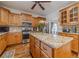 Gourmet kitchen featuring custom cabinetry, stainless steel appliances, and a large island at 230 Wild Barley Way, Loganville, GA 30052
