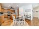 Open concept kitchen featuring an island, stainless appliances, and breakfast nook at 230 Wild Barley Way, Loganville, GA 30052