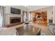 Spacious living room featuring a fireplace and seamless access to the gourmet kitchen at 230 Wild Barley Way, Loganville, GA 30052