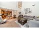 Open-concept living room with seamless access to the kitchen and loft area above at 230 Wild Barley Way, Loganville, GA 30052