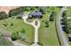 Beautiful aerial shot captures the home's grand entrance, circular driveway, and meticulously manicured grounds at 5010 Heardmont Trace Rd, Cumming, GA 30028