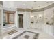 Spacious bathroom with tiled floors, a soaking tub, and a walk-in shower at 5010 Heardmont Trace Rd, Cumming, GA 30028