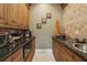 Charming butler's pantry boasts custom cabinetry, granite countertops, and stylish decor; perfect for entertaining at 5010 Heardmont Trace Rd, Cumming, GA 30028