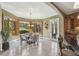 Bright dining area features large bay windows, tile flooring, chandelier and access to outdoor space at 5010 Heardmont Trace Rd, Cumming, GA 30028
