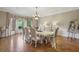 Elegant dining room featuring hardwood floors and large bay window at 5010 Heardmont Trace Rd, Cumming, GA 30028