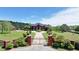 Stately brick home featuring a circular driveway and manicured lawn at 5010 Heardmont Trace Rd, Cumming, GA 30028