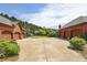Brick home featuring an extra-large garage and basketball court at 5010 Heardmont Trace Rd, Cumming, GA 30028