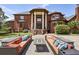 Large brick home featuring columns and multiple patios at 5010 Heardmont Trace Rd, Cumming, GA 30028