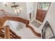Elegant foyer with hardwood stairs, tile flooring, and a grand light fixture at 5010 Heardmont Trace Rd, Cumming, GA 30028