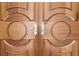 Elegant front door featuring custom wood design and decorative metal handle hardware at 5010 Heardmont Trace Rd, Cumming, GA 30028