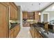 Modern kitchen with granite countertops, stainless steel appliances, and custom cabinets with ample storage at 5010 Heardmont Trace Rd, Cumming, GA 30028