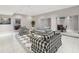 The living room includes a black and white patterned furniture set and floors with recessed lighting at 5010 Heardmont Trace Rd, Cumming, GA 30028