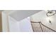Elegant curved wooden staircase featuring a beautiful chandelier and detailed trim at 5010 Heardmont Trace Rd, Cumming, GA 30028