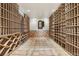 A custom wine cellar featuring a decorative tile floor and custom racks at 5010 Heardmont Trace Rd, Cumming, GA 30028