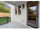 View of a covered back porch with gray wood and a door leading into the house at 779-B Lynwood Se St, Atlanta, GA 30312
