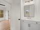 Bathroom featuring a white vanity with double sinks, a black-framed mirror, and views into the bedroom at 779-B Lynwood Se St, Atlanta, GA 30312