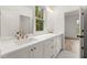 Bathroom featuring a double sink vanity, granite countertops, modern faucets, and views into the bedroom at 779-B Lynwood Se St, Atlanta, GA 30312