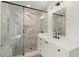 Modern bathroom featuring a glass-enclosed shower with marble-style tile, built-in bench, and a white vanity with a black faucet at 779-B Lynwood Se St, Atlanta, GA 30312