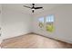 Bedroom featuring hardwood floors, large windows offering natural light, and views of the outdoors at 779-B Lynwood Se St, Atlanta, GA 30312