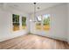 Bright dining area filled with natural light features hardwood flooring at 779-B Lynwood Se St, Atlanta, GA 30312