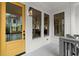 Close-up of a cheerful yellow front door and windows to the home's interior at 779-B Lynwood Se St, Atlanta, GA 30312