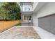 Charming two-story home featuring a welcoming front porch and a spacious driveway with beautiful pavers at 779-B Lynwood Se St, Atlanta, GA 30312