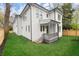 Exterior of a two-story home with white siding, a fenced backyard, and a well-manicured lawn at 779-B Lynwood Se St, Atlanta, GA 30312