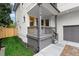 Picture of a quaint front porch with gray railings and a bright yellow front door at 779-B Lynwood Se St, Atlanta, GA 30312