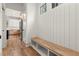 Bright hallway features a built-in bench with storage and views of the kitchen through an open doorway at 779-B Lynwood Se St, Atlanta, GA 30312