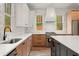 A modern kitchen with stainless steel appliances, marble backsplash, and updated countertops at 779-B Lynwood Se St, Atlanta, GA 30312