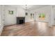 Inviting living room featuring a sleek fireplace, hardwood floors, and large windows at 779-B Lynwood Se St, Atlanta, GA 30312