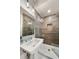 Modern bathroom with a glass-enclosed shower, stylish vanity, and elegant tile work, offering a spa-like experience at 986 Mauldin Se St, Atlanta, GA 30316