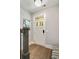 Bright entryway features a stylish front door, elegant hardwood floors, and modern decor at 986 Mauldin Se St, Atlanta, GA 30316