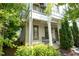 Charming two-story home with a cozy front porch and well-manicured landscaping in a suburban neighborhood at 986 Mauldin Se St, Atlanta, GA 30316