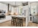 Modern kitchen featuring stainless steel appliances, a center island, and a wine cooler for entertaining guests at 986 Mauldin Se St, Atlanta, GA 30316