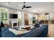 Spacious living room with open layout, fireplace, and an adjoining kitchen area at 986 Mauldin Se St, Atlanta, GA 30316