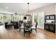 Open concept living room and dining area with hardwood floors and plentiful natural light at 986 Mauldin Se St, Atlanta, GA 30316