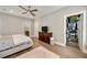 Main bedroom showcasing hardwood floors and a spacious walk-in closet and an ensuite bathroom at 986 Mauldin Se St, Atlanta, GA 30316