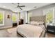 Bright main bedroom featuring hardwood floors, abundant natural light, and a ceiling fan at 986 Mauldin Se St, Atlanta, GA 30316