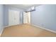 Spacious bedroom with double closets offering ample storage, and a view into an adjacent room, perfect for relaxation at 1111 Clairemont Ave # J6, Decatur, GA 30030