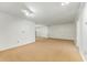 Bright living room with neutral walls, carpet flooring, and ample natural light at 1111 Clairemont Ave # J6, Decatur, GA 30030