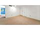 Inviting living room area with neutral walls, carpet, and an open doorway at 1111 Clairemont Ave # J6, Decatur, GA 30030
