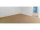 Bright living room with carpet, neutral walls, leading to blue room through an open door at 1111 Clairemont Ave # J6, Decatur, GA 30030